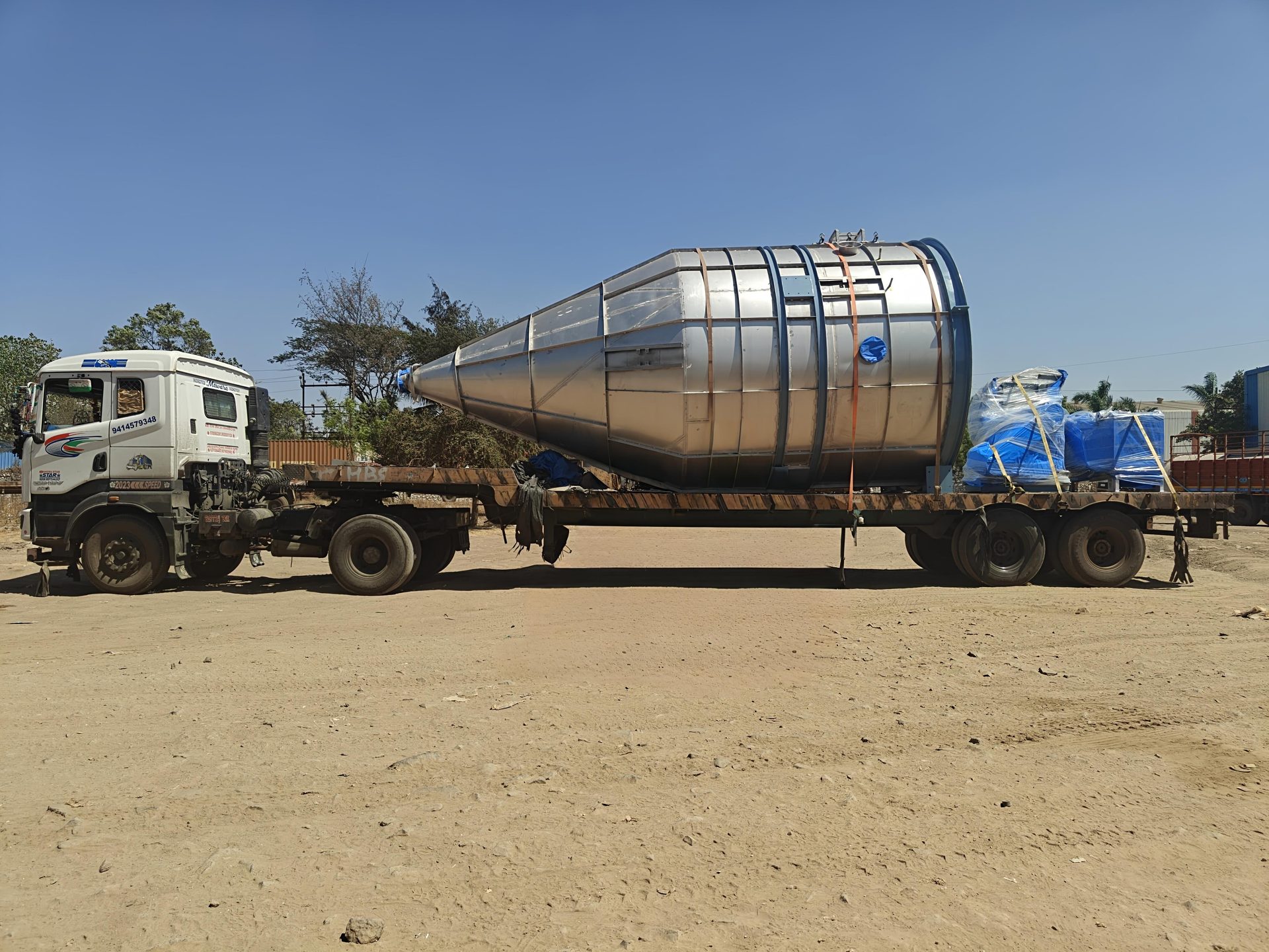Heavy industrial equipment on multi-axle trailer